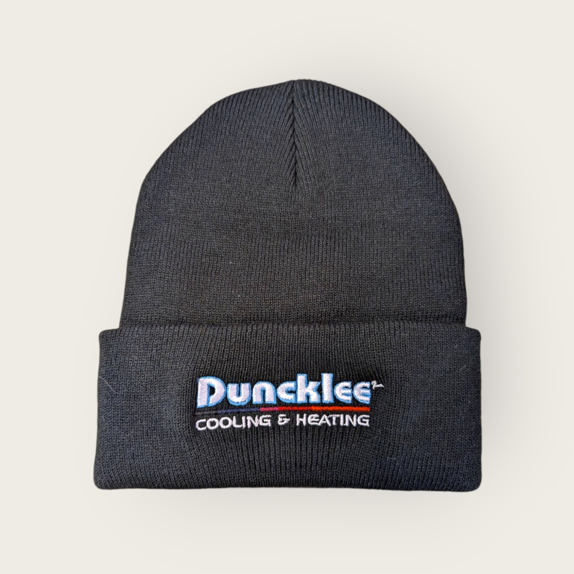 Black knit beanie custom embroidered with the Duncklee Cooling & Heating logo