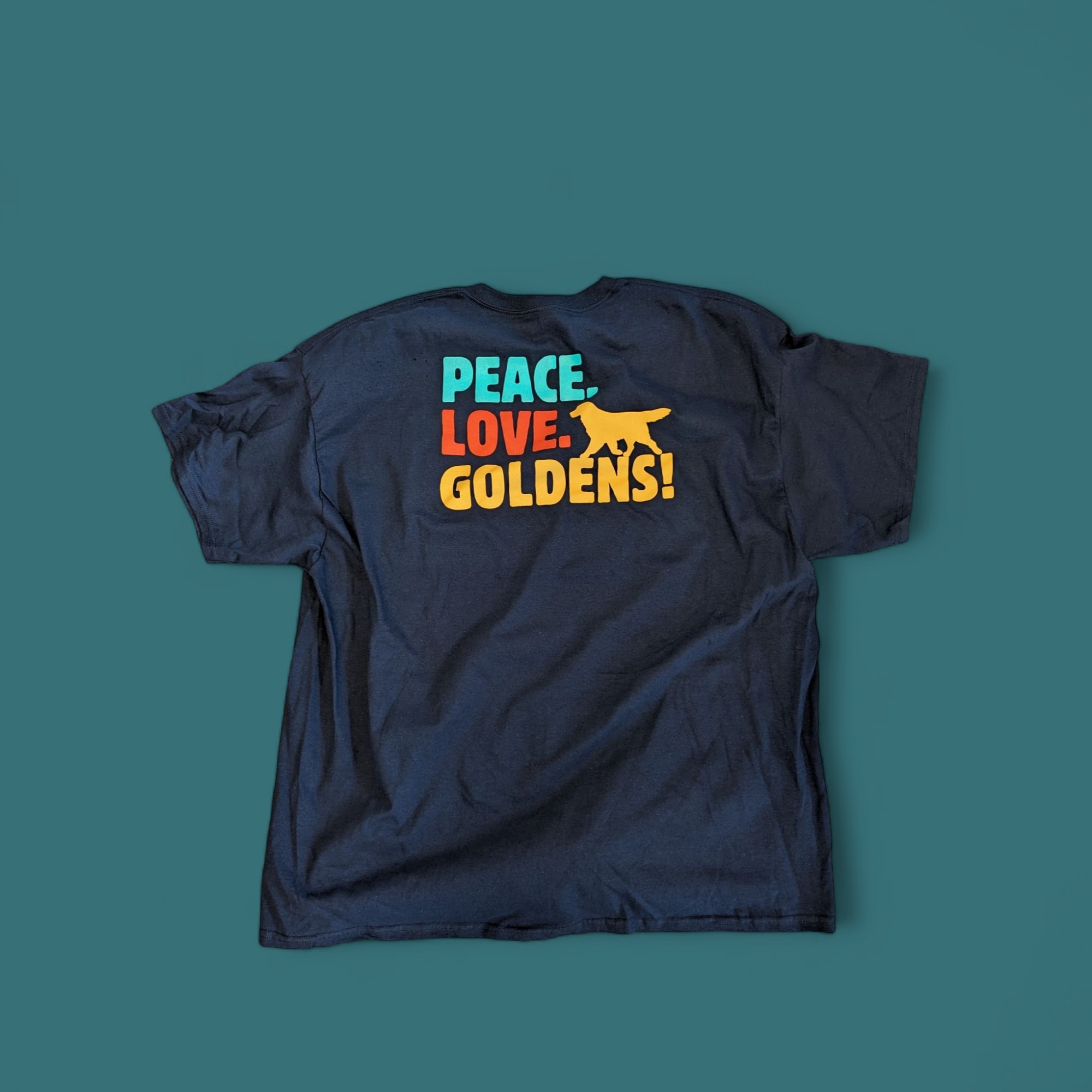 T-shirt screen printed with a “Peace. Love. Goldens!” design