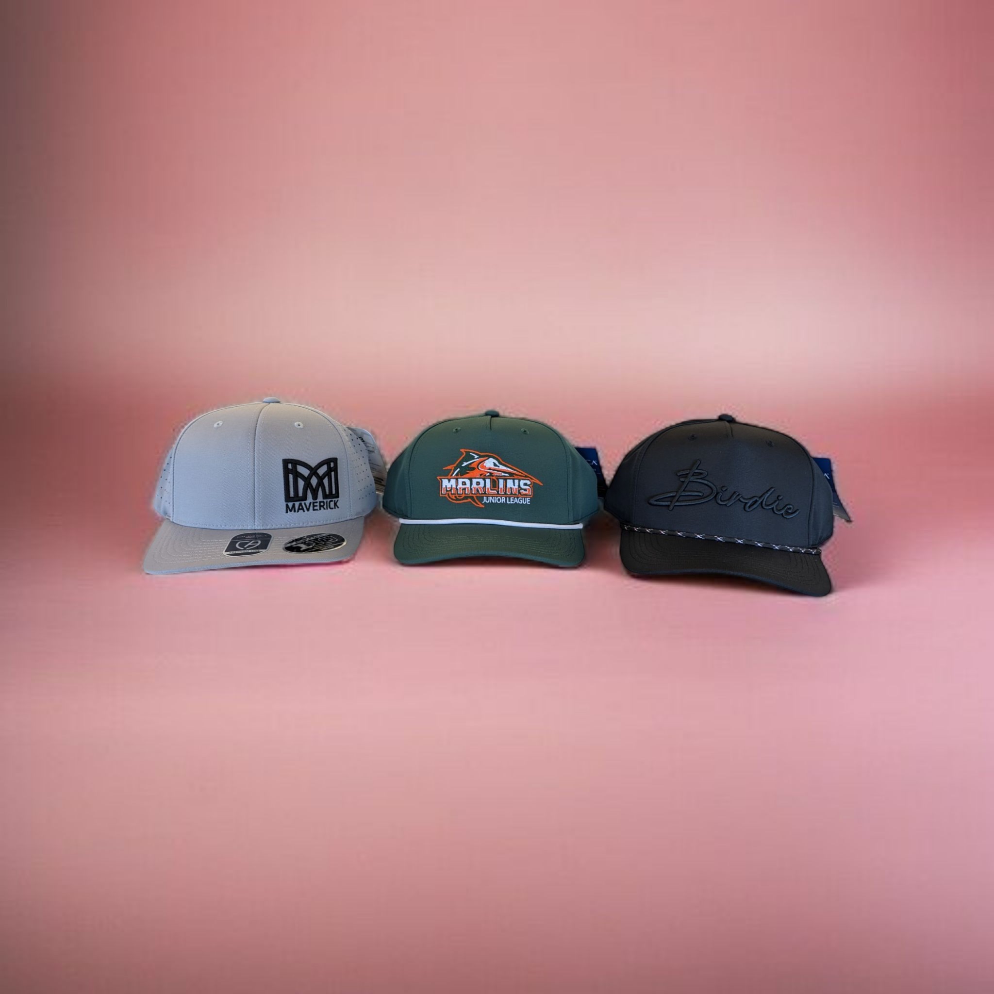 Three custom embroidered hats for Maverick, Marlins Junior League, and Birdie